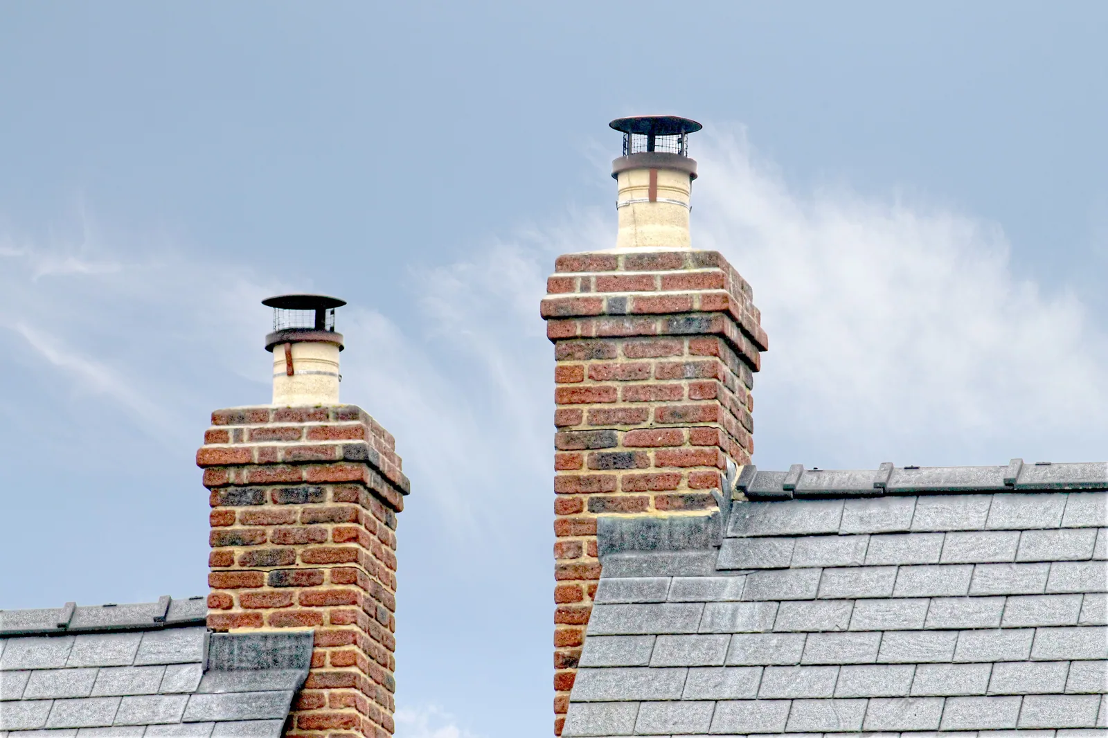 Re-pointed brick chimney stack on a British house