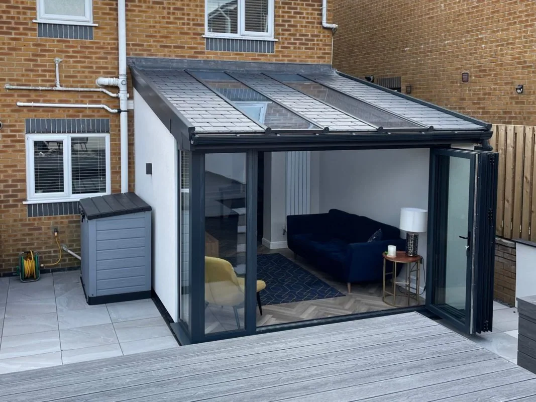 Modern conservatory extension with a tiled warm roof