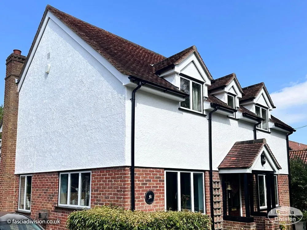 White fascias with black guttering on a UK detached home
