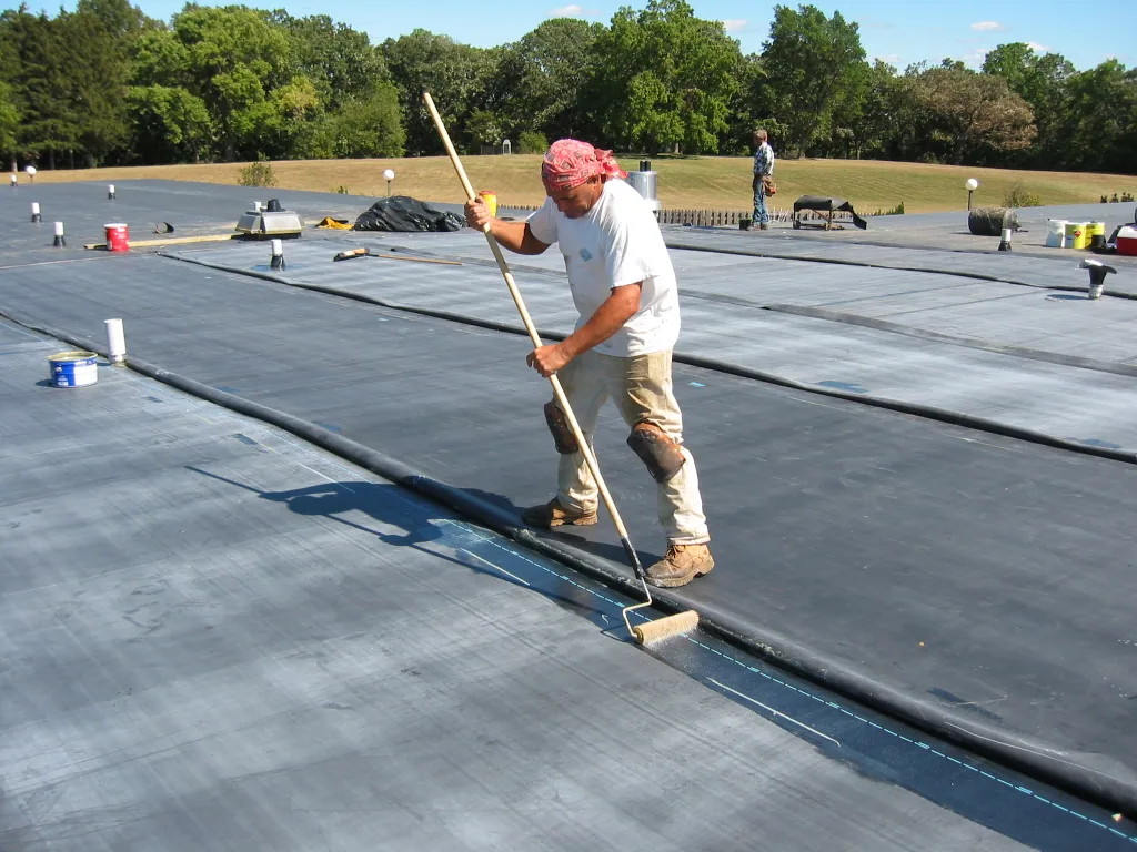 Flat roof membrane being installed on a UK building