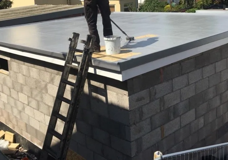 GRP fibreglass flat roof being applied on a UK property