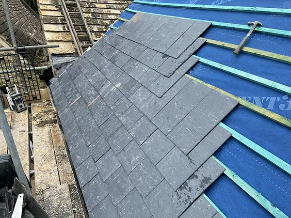 Grey slate roof on a UK house after repair work